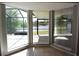 Inviting lake view framed by bright bay windows bringing natural light into this sunroom at 23310 Cascade Pl, Land O Lakes, FL 34639