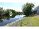 Backyard pond and beautiful landscaping, offering a serene view at 23310 Cascade Pl, Land O Lakes, FL 34639