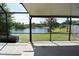 A stunning view of the lake from the screened-in patio at 23310 Cascade Pl, Land O Lakes, FL 34639