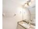 Updated bathroom with granite vanity, modern fixtures, and neutral color palette at 290 Winchester Way, Palm Harbor, FL 34684