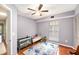 Bedroom with hardwood floors and ceiling fan at 290 Winchester Way, Palm Harbor, FL 34684