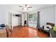 Spacious bedroom with hardwood floors and a ceiling fan at 290 Winchester Way, Palm Harbor, FL 34684