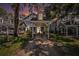 Charming townhomes with covered parking, highlighted by a beautiful sunset backdrop at 290 Winchester Way, Palm Harbor, FL 34684