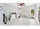 Kitchenette features white cabinetry, tile floors, and sliding doors to deck at 290 Winchester Way, Palm Harbor, FL 34684