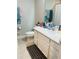 Bright bathroom featuring a vanity with ample counter space and storage at 3037 Jacob Crossing Ln, Holiday, FL 34691