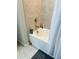 Clean white bathtub with ceramic tile surround and shower at 3037 Jacob Crossing Ln, Holiday, FL 34691