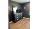 Well-organized bedroom featuring a dresser with modern hardware and ample storage at 3037 Jacob Crossing Ln, Holiday, FL 34691