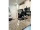 Well-appointed kitchen with granite countertops and stainless steel appliances at 3037 Jacob Crossing Ln, Holiday, FL 34691