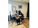Functional office space with a modern desk, ergonomic chair, and ample workspace at 3037 Jacob Crossing Ln, Holiday, FL 34691