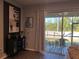 Cozy covered screened patio with chairs, perfect for outdoor relaxation and entertaining at 3037 Jacob Crossing Ln, Holiday, FL 34691