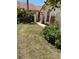 Manicured front yard with mature landscaping and decorative walkway at 3054 Pelican Pl, Clearwater, FL 33762