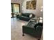 Spacious living room with modern sofas and ample natural light, perfect for relaxing at 3054 Pelican Pl, Clearwater, FL 33762