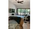 Open-concept living room features sleek furnishings, a ceiling fan, and large sliding glass doors to the patio at 3054 Pelican Pl, Clearwater, FL 33762