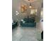 Inviting living room featuring a stylish blue sofa and contemporary decor at 3054 Pelican Pl, Clearwater, FL 33762