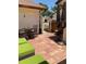 Inviting patio with wicker furniture, umbrella, and tiled flooring for outdoor relaxation at 3054 Pelican Pl, Clearwater, FL 33762