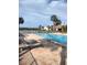 Inviting community pool featuring lounge chairs and scenic views of the surrounding area at 3054 Pelican Pl, Clearwater, FL 33762