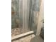 Clean, modern shower area with stylish tiling, bronze fixtures, and transparent curtain at 3054 Pelican Pl, Clearwater, FL 33762