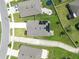 An aerial view of rooftops, driveways, and backyard features such as trampolines at 30639 Summer Sun Loop, Wesley Chapel, FL 33545