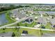 Aerial view of a lovely backyard with fence, landscaping, and solar panels at 30639 Summer Sun Loop, Wesley Chapel, FL 33545