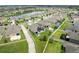 Aerial view of backyards featuring pools, a trampoline and lush lawns at 30639 Summer Sun Loop, Wesley Chapel, FL 33545