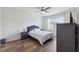 Bedroom boasts a ceiling fan, wood-look floors, and plenty of natural light at 30639 Summer Sun Loop, Wesley Chapel, FL 33545