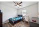 bedroom features wood-look flooring and a ceiling fan at 30639 Summer Sun Loop, Wesley Chapel, FL 33545