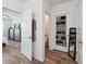 Hallway view includes a bedroom and bathroom, showcasing the home's layout and flow at 30639 Summer Sun Loop, Wesley Chapel, FL 33545