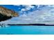 Breathtaking lagoon view, clear turquoise water under a bright, partly cloudy sky at 30639 Summer Sun Loop, Wesley Chapel, FL 33545