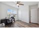 Office boasts a ceiling fan, wood-look floors, and plenty of natural light at 30639 Summer Sun Loop, Wesley Chapel, FL 33545