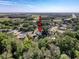 An aerial view of the property, backing up to a wooded area in a quiet neighborhood near a major highway at 3142 Crenshaw Ct, New Port Richey, FL 34655