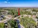 An aerial view of a property with a well maintained lawn and mature trees in a quiet, established neighborhood at 3142 Crenshaw Ct, New Port Richey, FL 34655