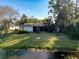 Beautiful lawn leading to a pond behind this cozy home at 3142 Crenshaw Ct, New Port Richey, FL 34655