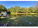 Tranquil backyard featuring water views, stepping stones and room for entertaining at 3142 Crenshaw Ct, New Port Richey, FL 34655