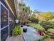 The outdoor space features a patio, lush landscaping, and mature trees, creating a peaceful oasis at 3142 Crenshaw Ct, New Port Richey, FL 34655
