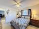 Bedroom with light wood floors and a large closet, and neutral colored decor at 3142 Crenshaw Ct, New Port Richey, FL 34655