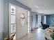 Bright and inviting foyer with tile flooring, a decorative front door, and a glimpse into the living area at 3142 Crenshaw Ct, New Port Richey, FL 34655