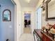 Hallway with decorative nautical accents, light colored walls, and white trim at 3142 Crenshaw Ct, New Port Richey, FL 34655