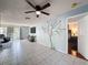 Spacious living room with tile flooring, natural light, and access to the Primary bedroom at 3142 Crenshaw Ct, New Port Richey, FL 34655