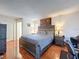 Serene main bedroom features a comfortable bed, warm lighting, and ample space at 3142 Crenshaw Ct, New Port Richey, FL 34655