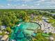 Aerial shot of clear spring waters with people swimming and enjoying the amenities at 3215 Hibiscus Dr, Hernando Beach, FL 34607