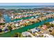 Expansive aerial view showcasing a waterfront community with numerous homes along canals and waterfront access at 3215 Hibiscus Dr, Hernando Beach, FL 34607