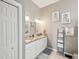 Bathroom featuring double sinks, granite countertops, and modern fixtures with tile flooring at 3215 Hibiscus Dr, Hernando Beach, FL 34607
