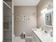 Bathroom featuring a white marble countertop and tiled shower at 3215 Hibiscus Dr, Hernando Beach, FL 34607