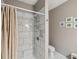 Bathroom with tiled shower and marble flooring at 3215 Hibiscus Dr, Hernando Beach, FL 34607
