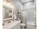 Bathroom with shower and tub combination, decorative turtle art, and vanity at 3215 Hibiscus Dr, Hernando Beach, FL 34607