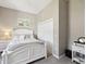 Comfortable bedroom featuring neutral decor and white furniture including a bed and side tables at 3215 Hibiscus Dr, Hernando Beach, FL 34607