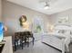 Comfortable bedroom featuring neutral decor and white furniture including a bed and antique desk at 3215 Hibiscus Dr, Hernando Beach, FL 34607