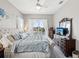 Luxurious bedroom featuring neutral decor, white trim, and a comfortable king bed with plush bedding at 3215 Hibiscus Dr, Hernando Beach, FL 34607