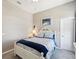 Comfortable bedroom with neutral walls, white furniture, and a cozy bed with blue blanket at 3215 Hibiscus Dr, Hernando Beach, FL 34607