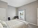 Cozy bedroom with exposed block walls and a window overlooking the backyard waterfront at 3215 Hibiscus Dr, Hernando Beach, FL 34607
